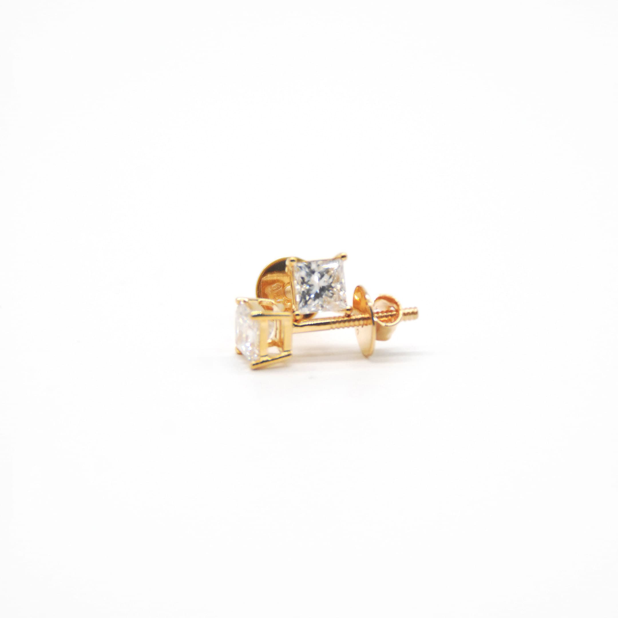 Princess-cut diamond stud earrings in yellow gold