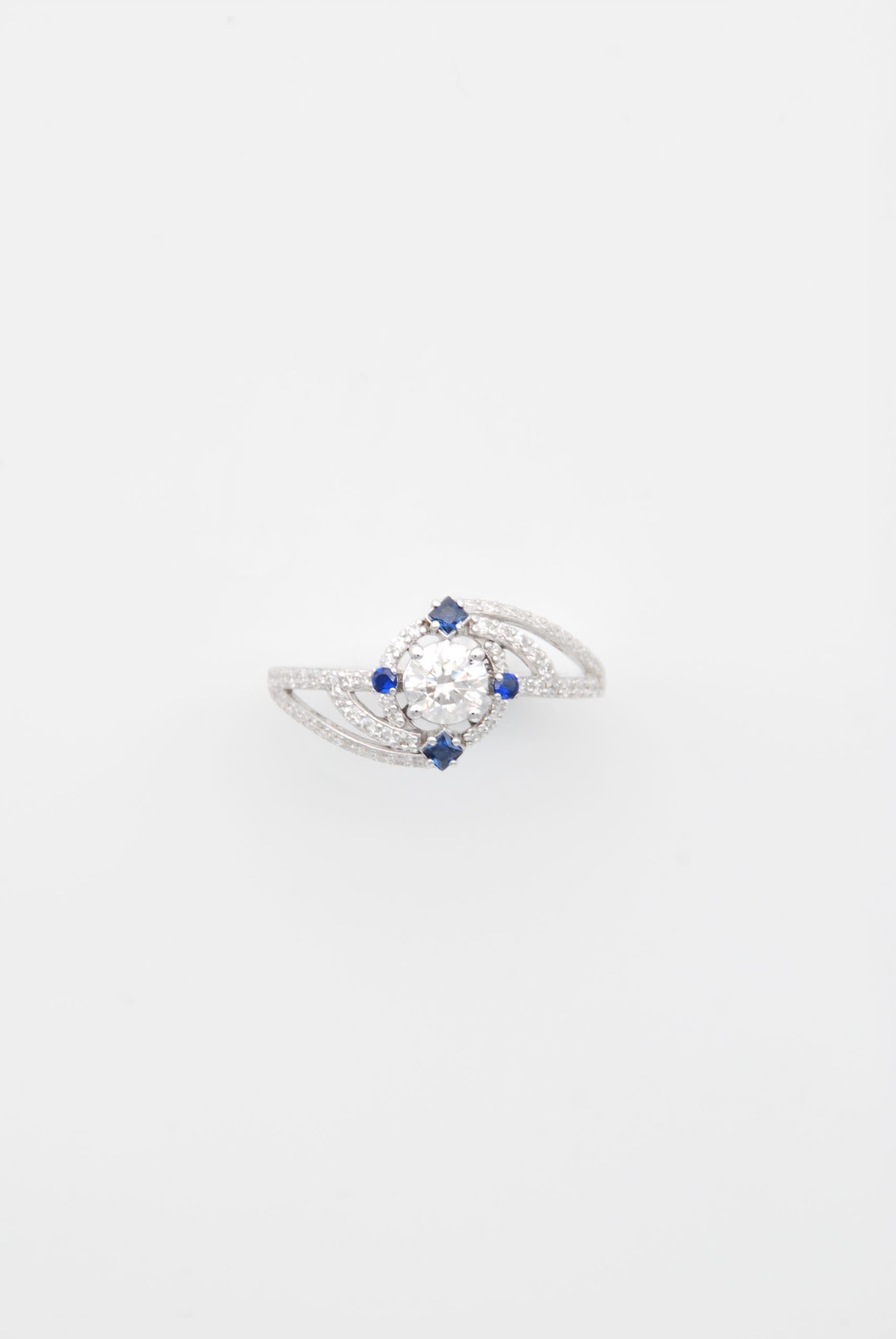 White gold diamond ring with sapphire accents