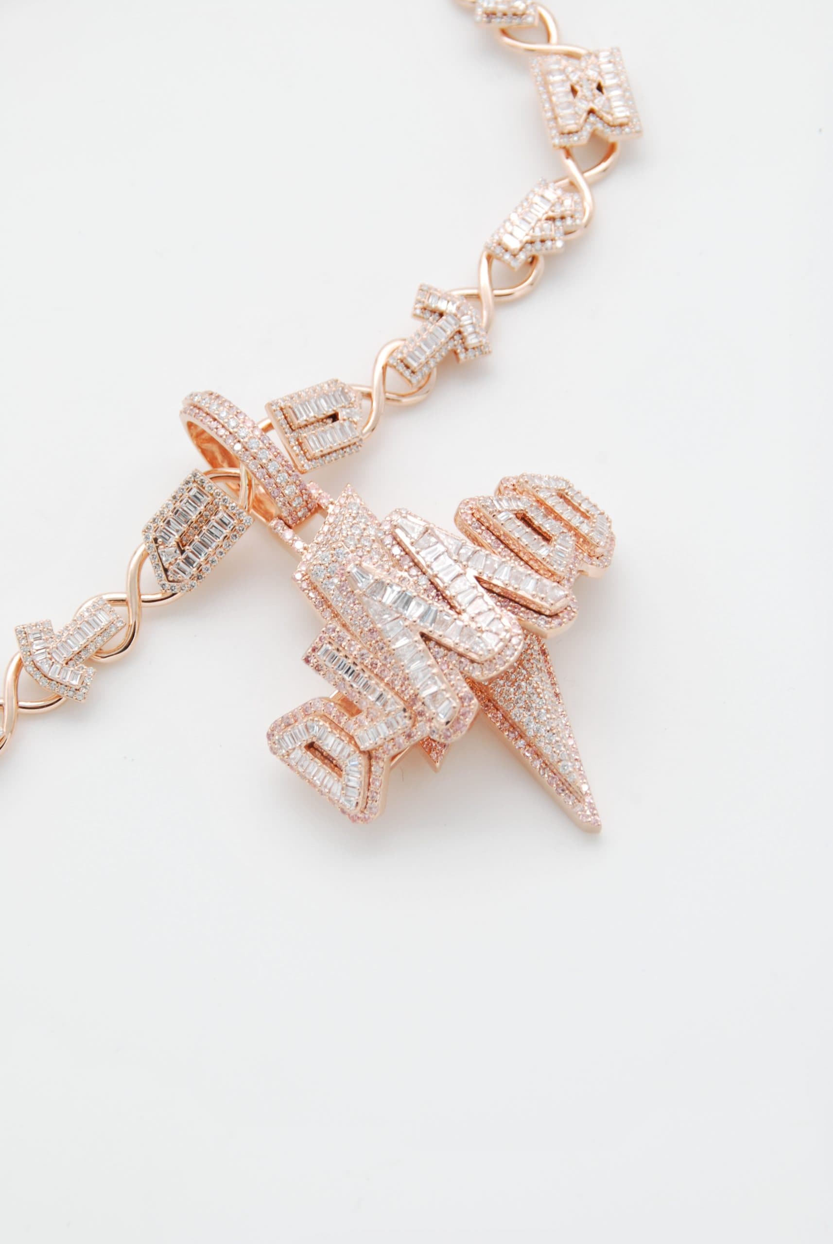 Baguette diamond name pendant with a lightning bolt on a matching chain