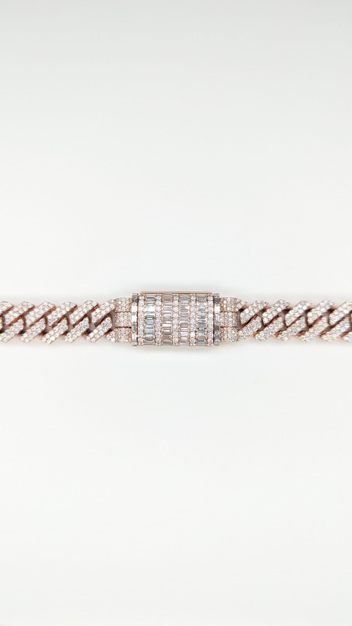 Rose gold prong-link diamond bracelet with a baguette clasp