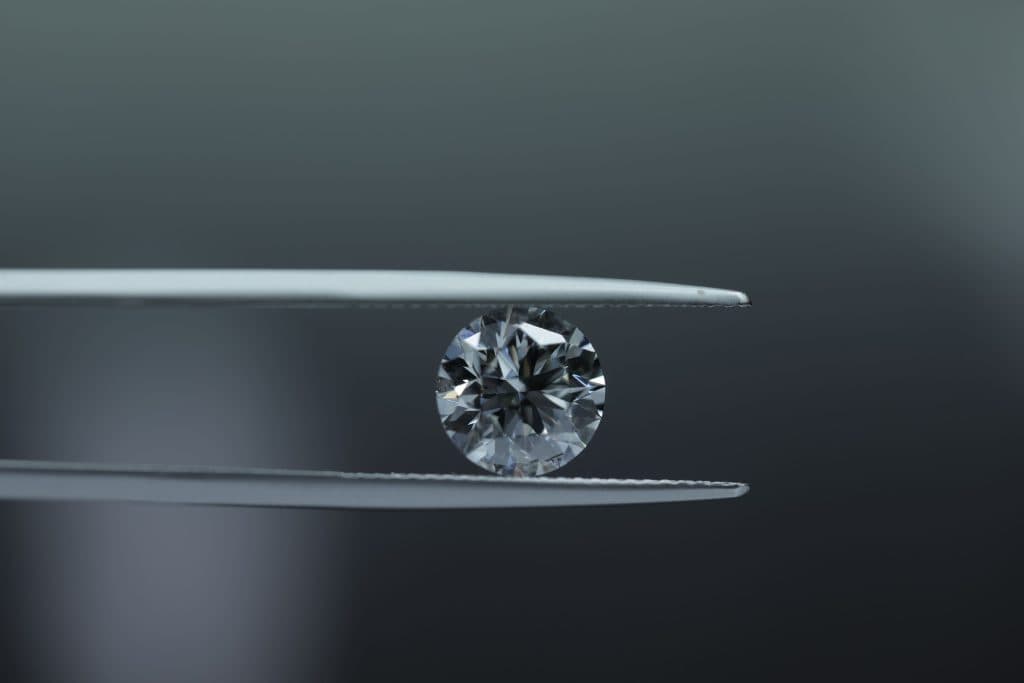 Loose diamonds being inspected in the atelier